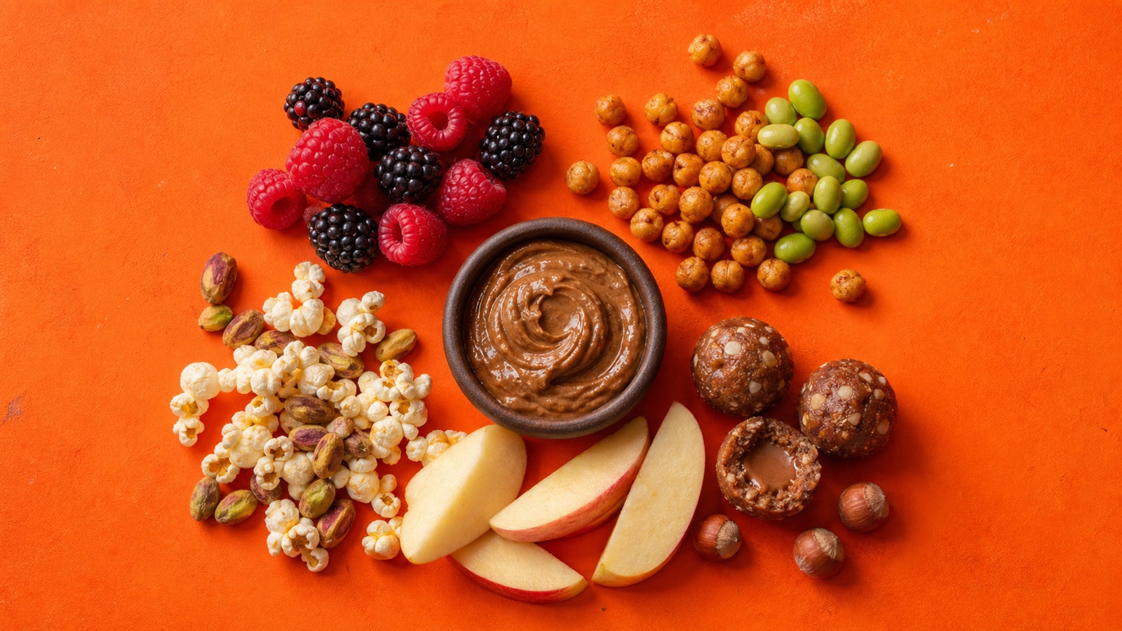 Sweet and savory snack ideas with berries, roasted chickpeas, apple and hazelnut butter